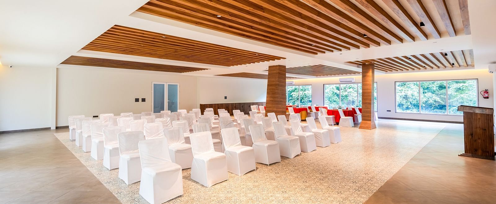 Banquet Hall at DLS Divine River Resort and Spa featuring  chairs table arranged in theater setting and a stage