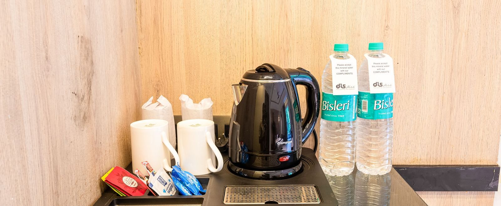 Premium Room at DLS Divine River Resort and Spa featuring tea and coffee maker kept on a table.