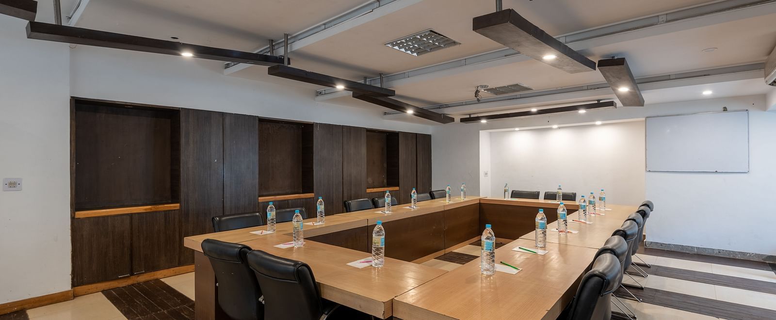 Overview of Conference Hall  at DLS Spring Valley Resort Dharamshala  with chairs and tables arranged in boardroom setting 