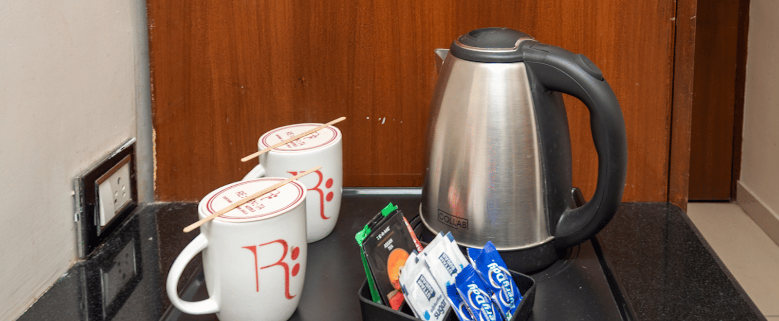 Tea and coffee maker with kettle and mugs at DLS Hotels On The Ganges.
