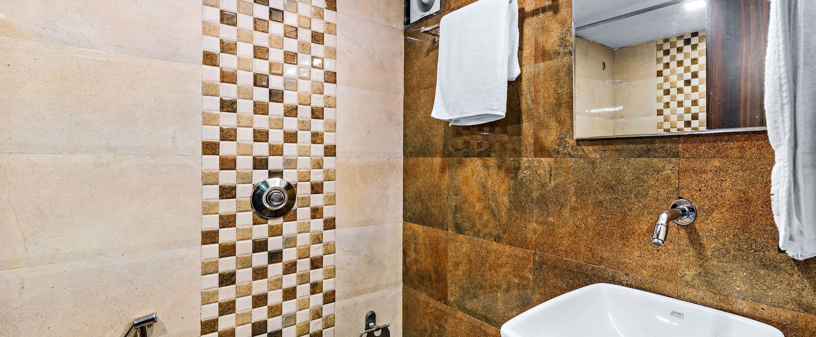 A washroom in Royal Executive room at Krushnai Resort.