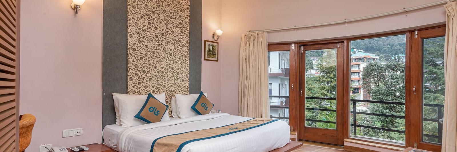 A Luxury Cottage at DLS Spring Valley Resort Dharamshala featuring a king size bed, table and a big balcony