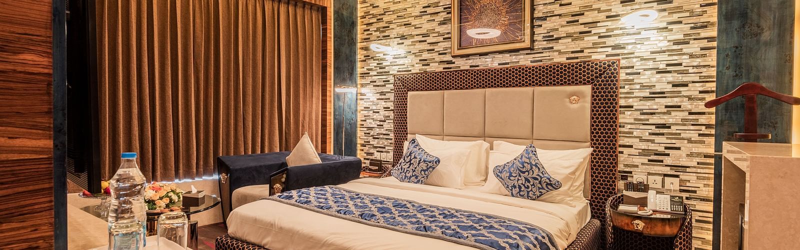 Queen suite featuring a bed overlooking a window at Hotel Park Elanza, Coimbatore