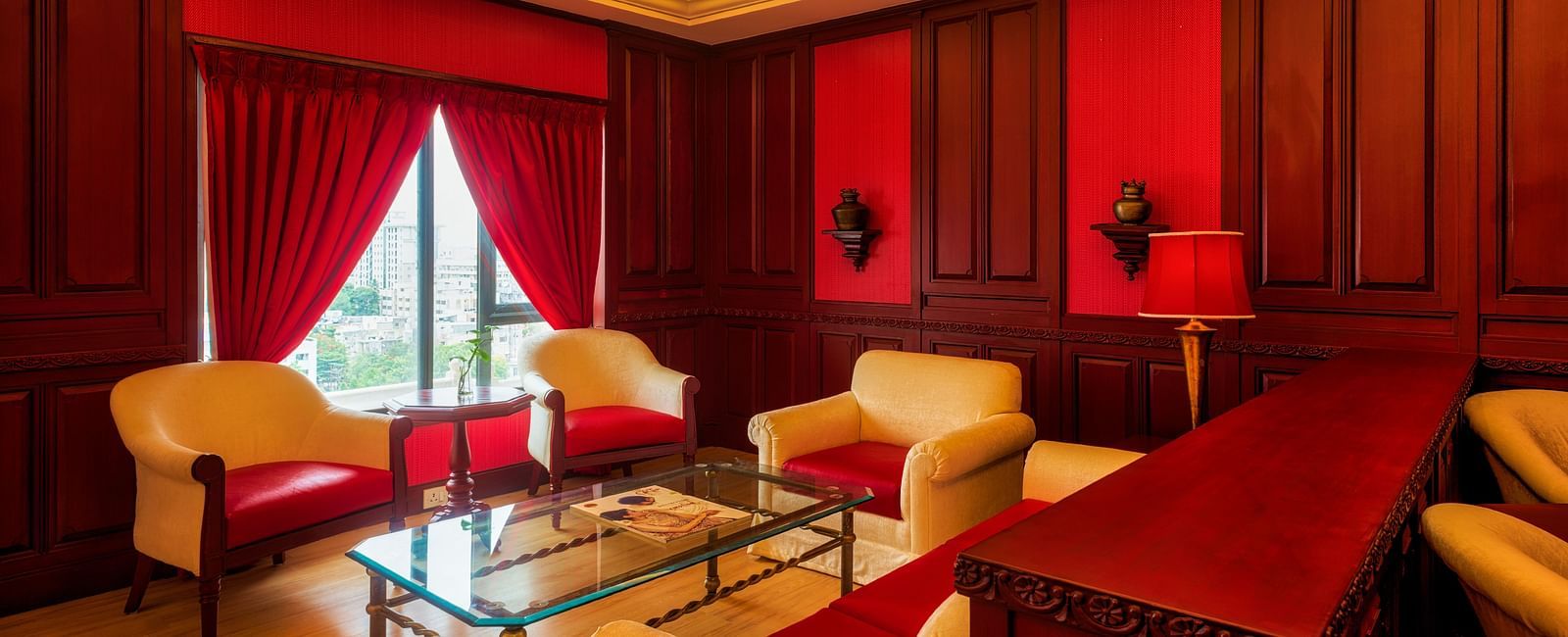  Room with sofas and tables at Grand Chennai By GRT Hotels.