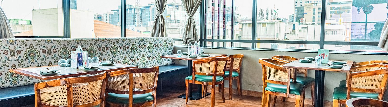 Wooden chair Seating at Kyba at Visthara - Urban Boutique Hotel 5