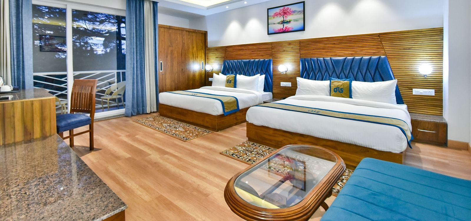 Two large beds with elegant interiors and ambient lighting in Family Suite Room at DLS Ark Holiday Inn, Banikhet.