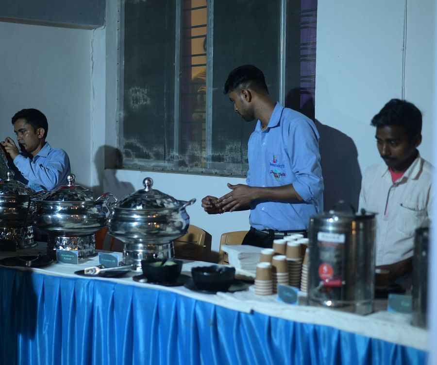Buffet area featuring the catering staff serving various dishes at Rangamati Garden Resort.