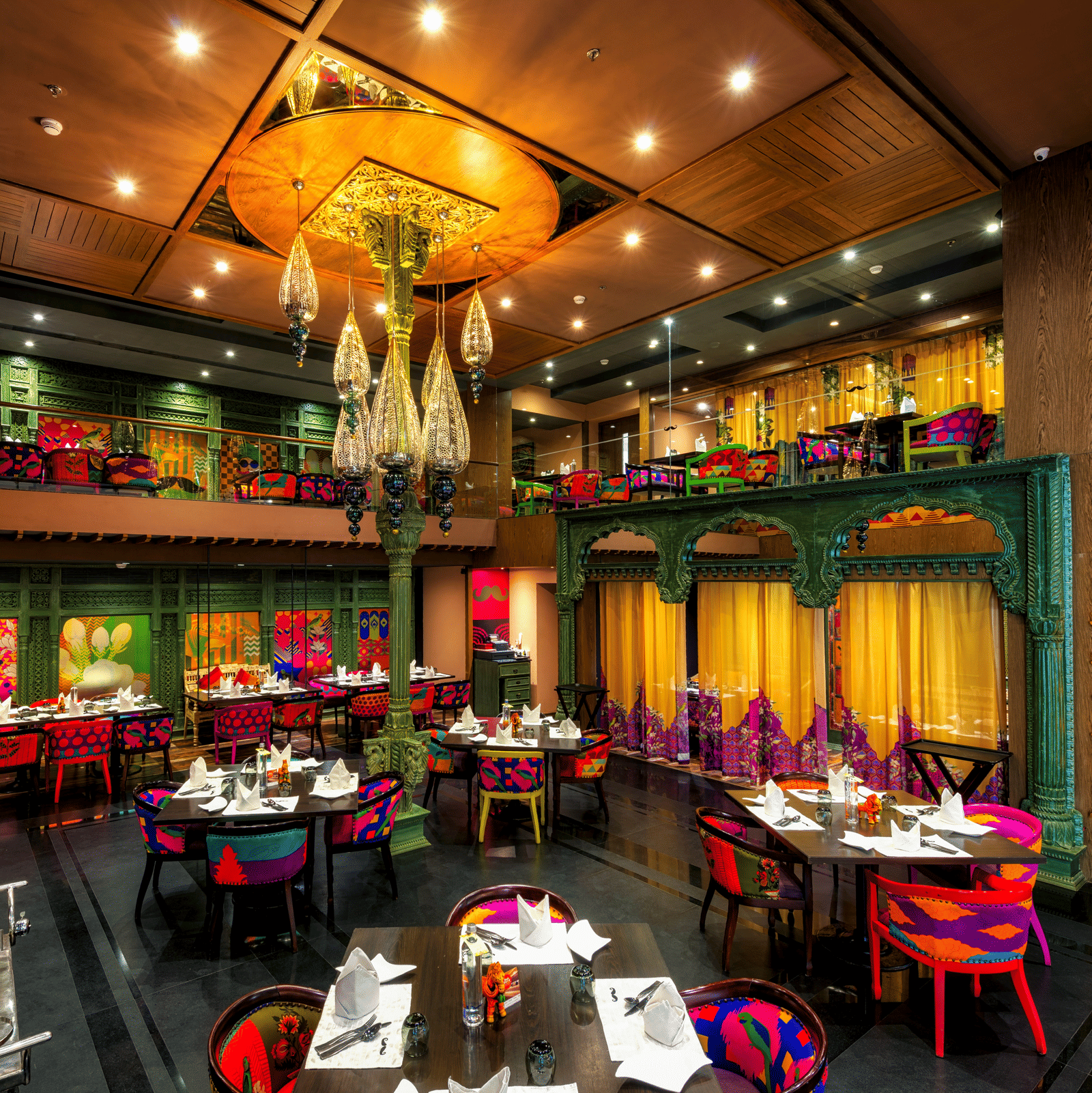 Seating arrangement of the restaurant at Grand Chennai By GRT Hotels.