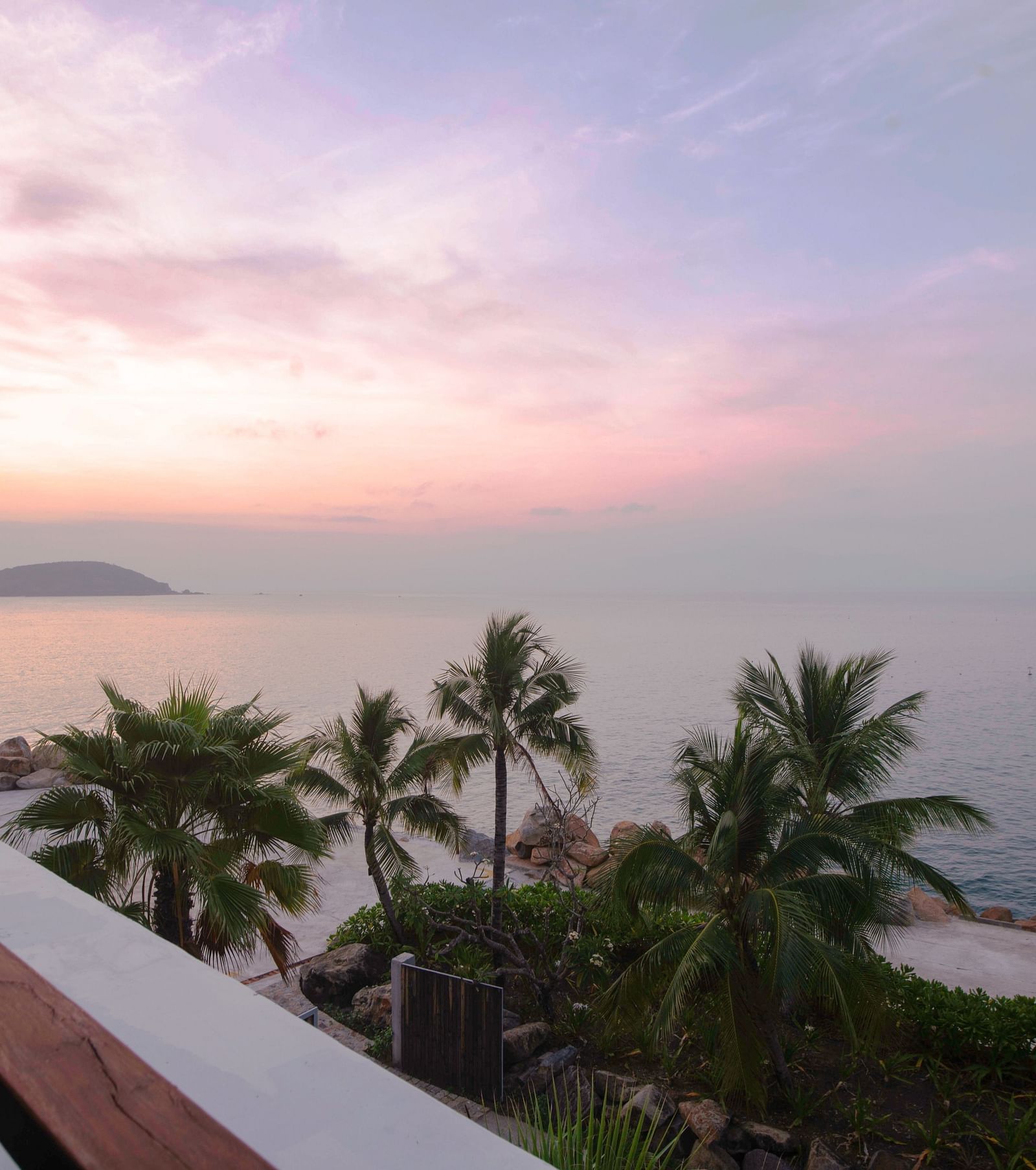Another view of palm trees near a sea seen during a sunset through our balcony - Alibu Resort Nha Trang