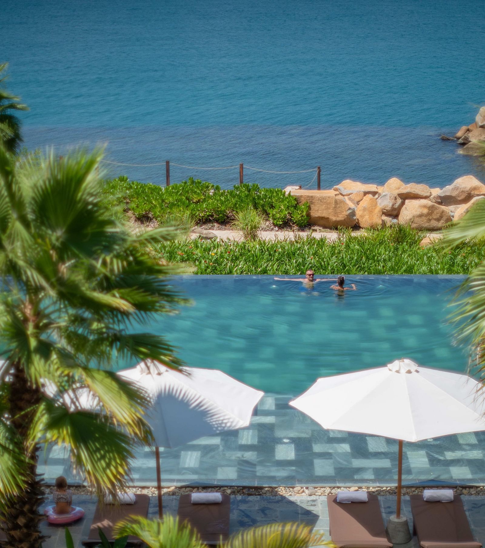 An aerial view of the pool at our resort with parasol by the side - Alibu Resort Nha Trang