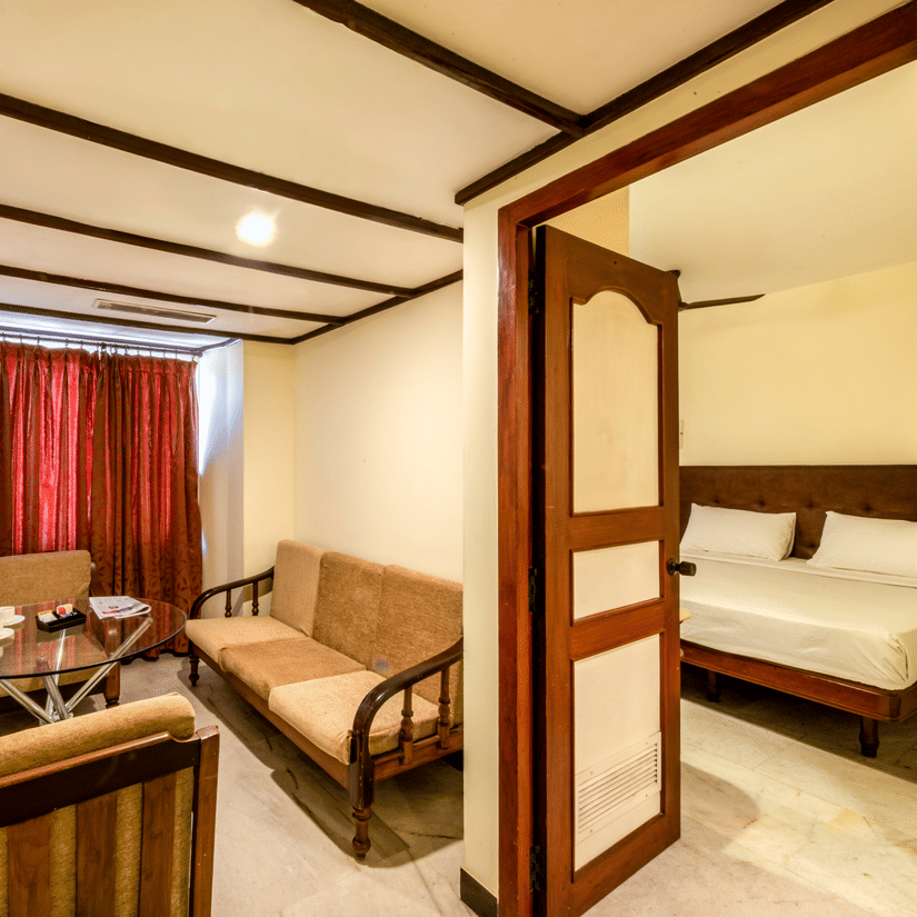 Spacious suite at Jayaram Hotel, Pondicherry with separate living and sleeping areas for a comfortable stay.