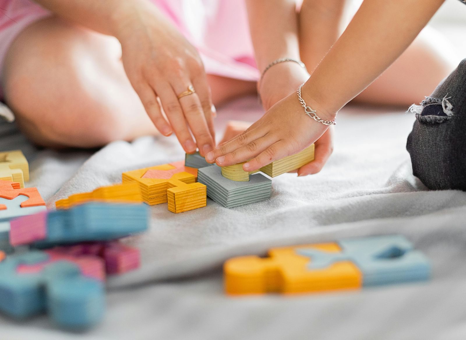 A close up shot showcasing puzzles played by two people