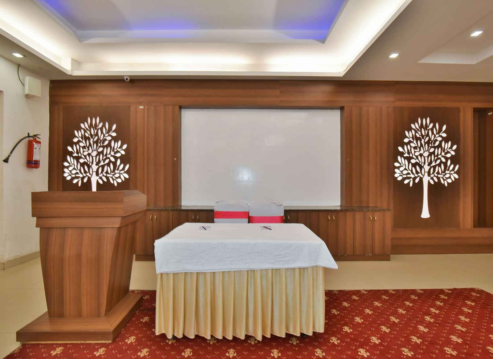 A podium next to a table at Conference Hall at DLS Highland Resort and Spa, Mussoorie.