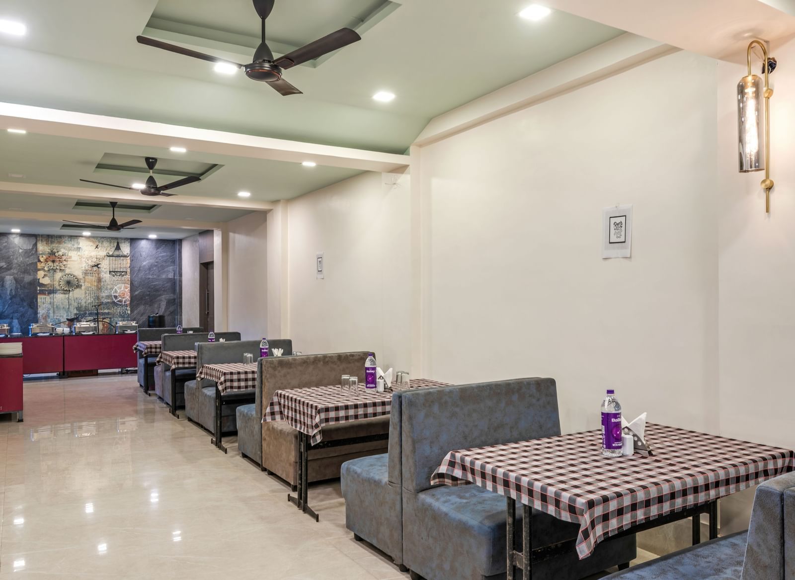 Indoor dining area with neatly arranged tables at Emerald Retreat, Tungarli.