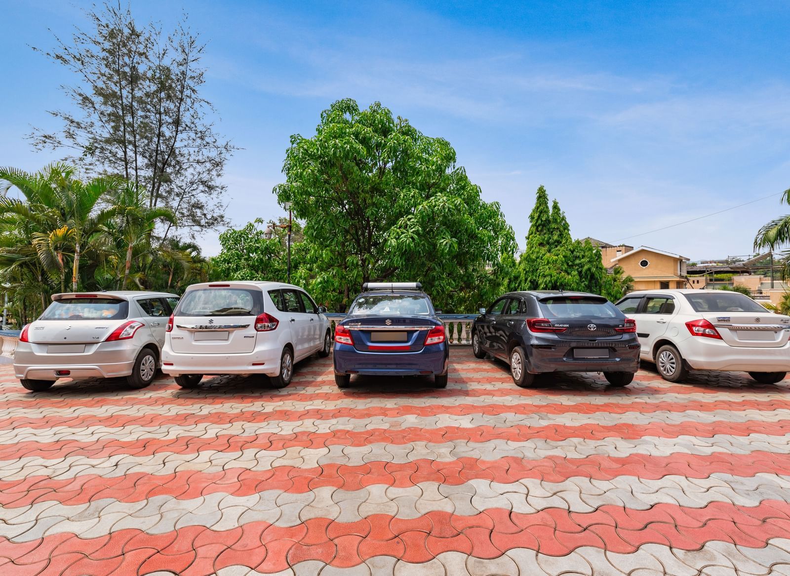 Cars parked next to each other in a parking slot at Mayur Resort.