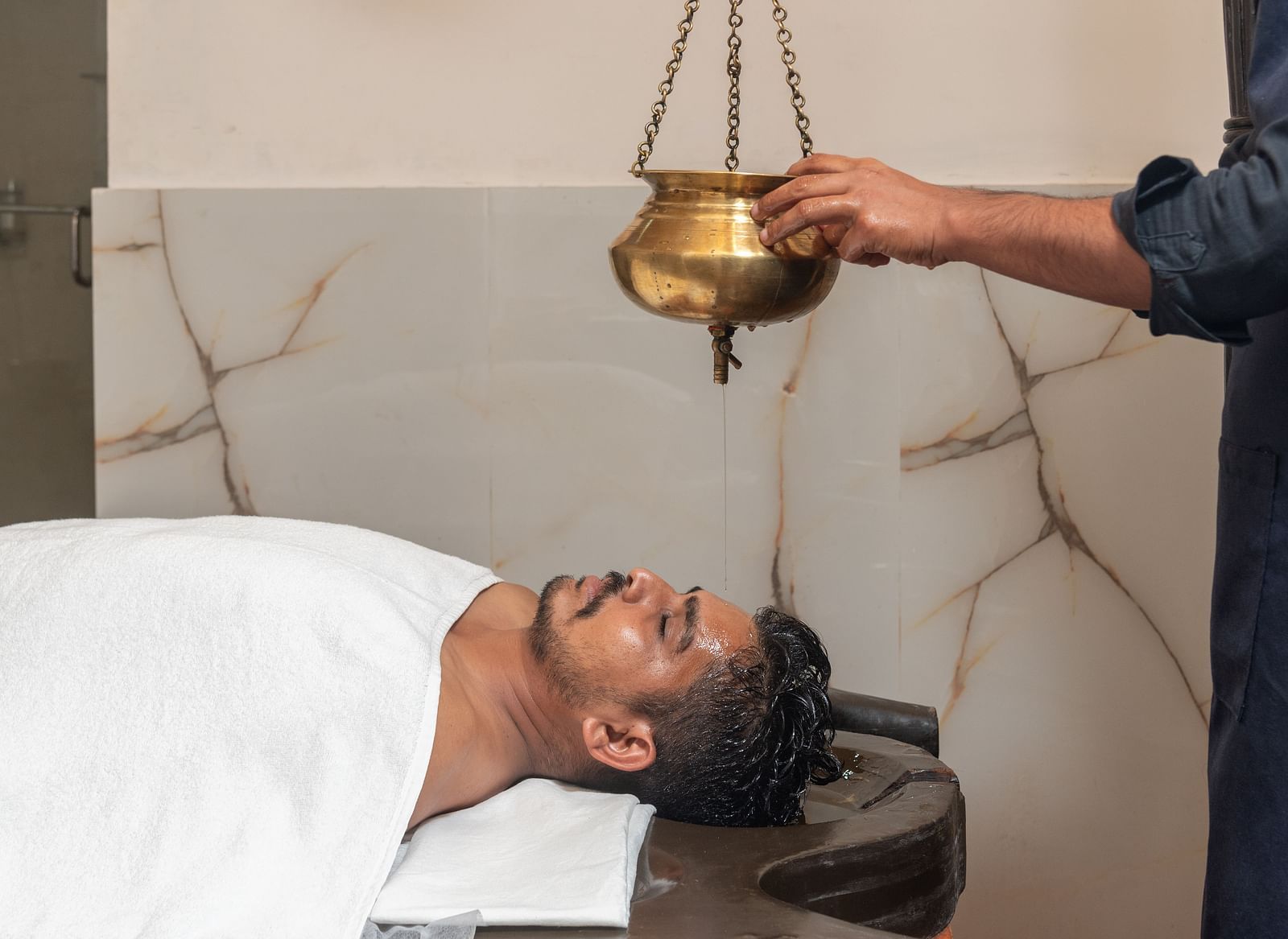 Shirodhara Ayurvedic therapy in progress at Regenta Inn DLS, Rishikesh.