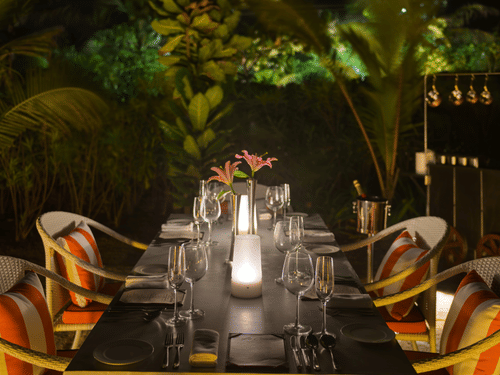 A table for 4 guests in an outdoor setting of La Concha set for a cosy intimate diner at Azaya Beach Resort, Goa.