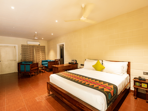 an overview of the Suite with a double bed at Ibex River Resort, Pollachi