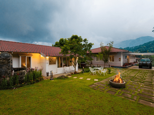 Annexe and Main House Exterior with out seating and campfire - Ibex Resort, Kotagiri