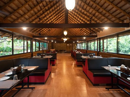 an overview of Aqua Restaurant at Ibex River Resort, Pollachi