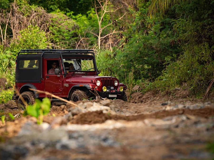 a Jeep travelling by the river bed near Ibex River Resort, Pollachi