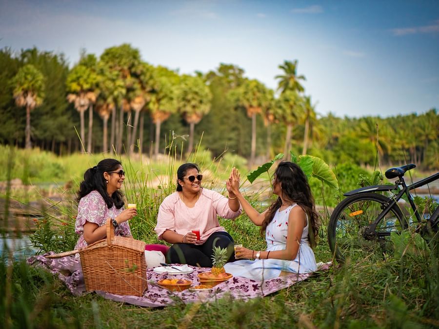 a group of women having a picnic  - Ibex River Resort, Pollachi