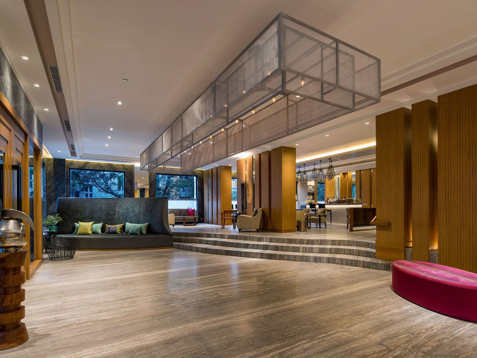 An overview of the Lobby at The Raintree St. Mary s Road with high ceiling and chic decor.
