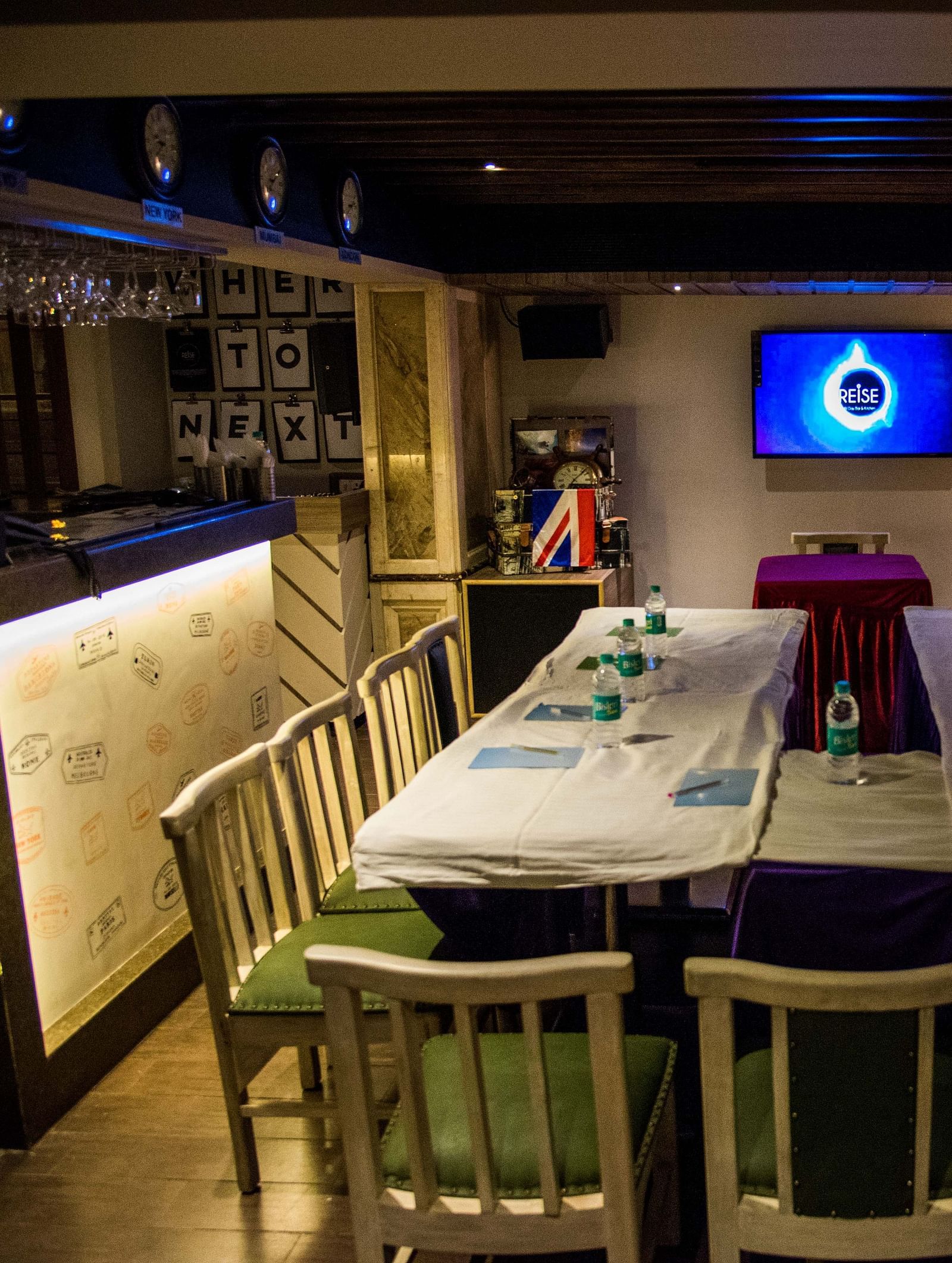 Cosy restaurant interior with a central table set for a meal under warm lighting at Oriental Aster, Mumbai.