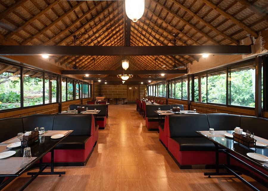 an overview of Aqua Restaurant at Ibex River Resort, Pollachi