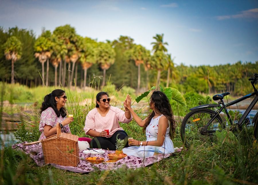 a group of women having a picnic  - Ibex River Resort, Pollachi