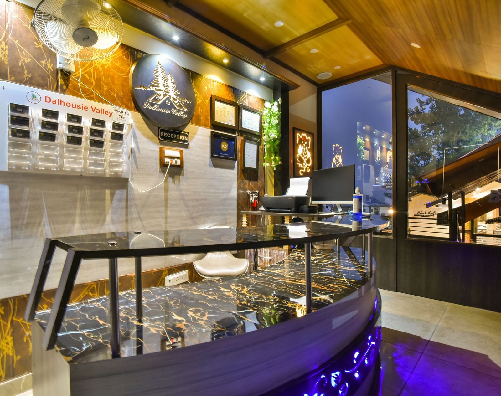 Reception at DLS Dalhousie Valley Resort with a  table and ambient lighting 
