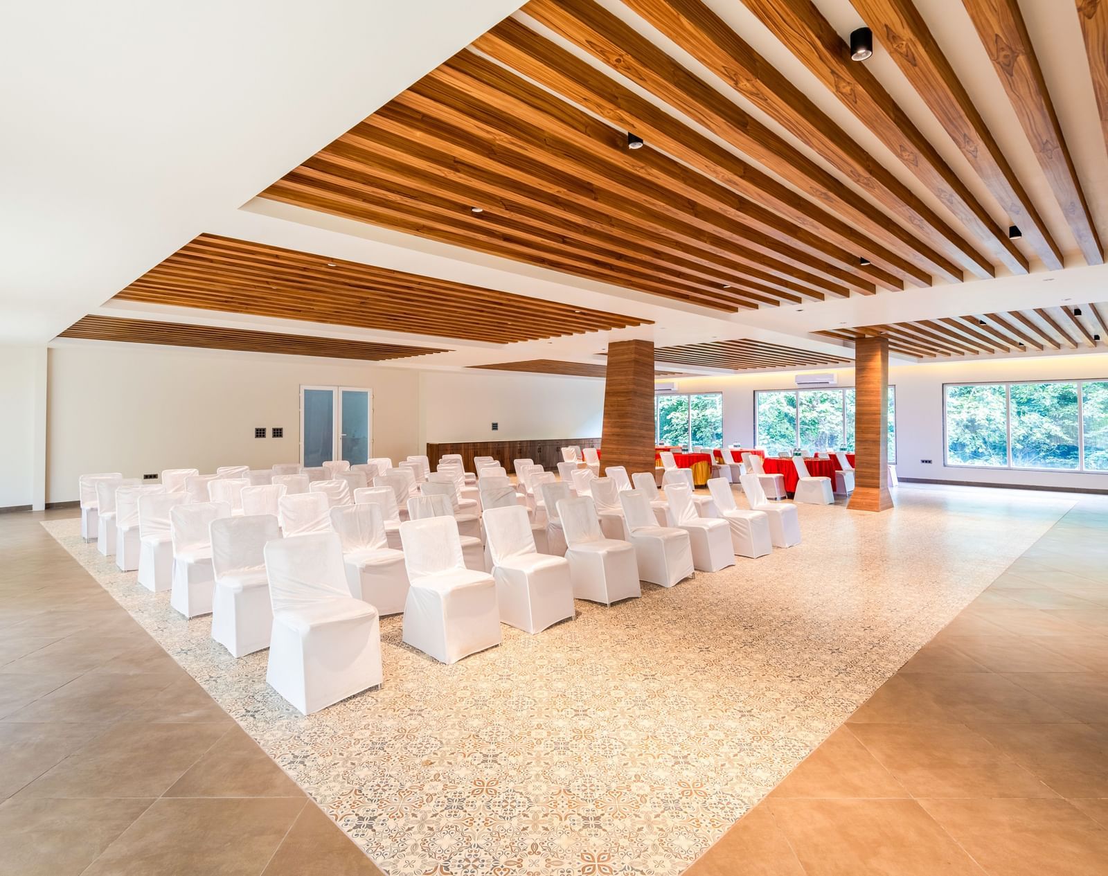 Banquet Hall at DLS Divine River Resort and Spa featuring  chairs table arranged in theater setting and a stage