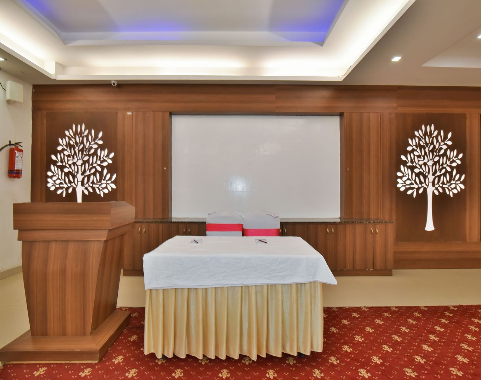 A podium next to a table at Conference Hall at DLS Highland Resort and Spa, Mussoorie.