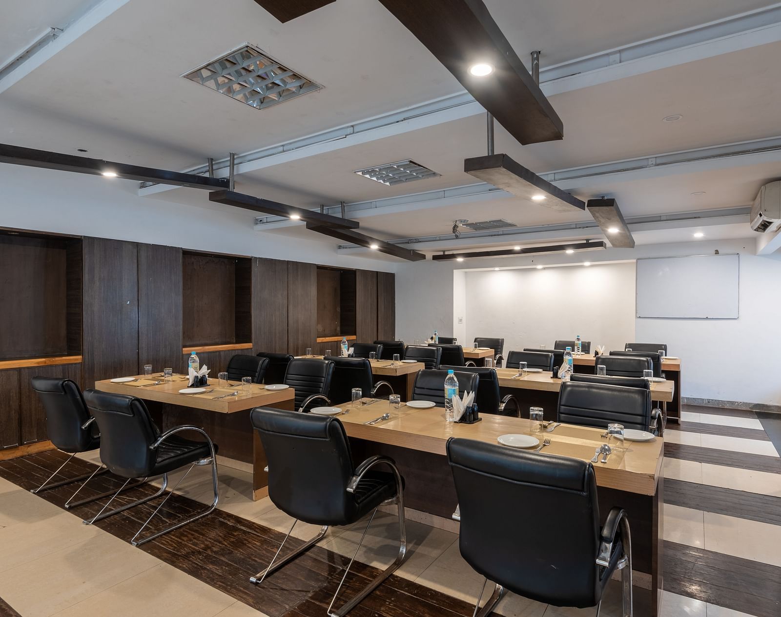 Conference Hall  at DLS Spring Valley Resort Dharamshala  with chairs and tables arranged in classroom setting 