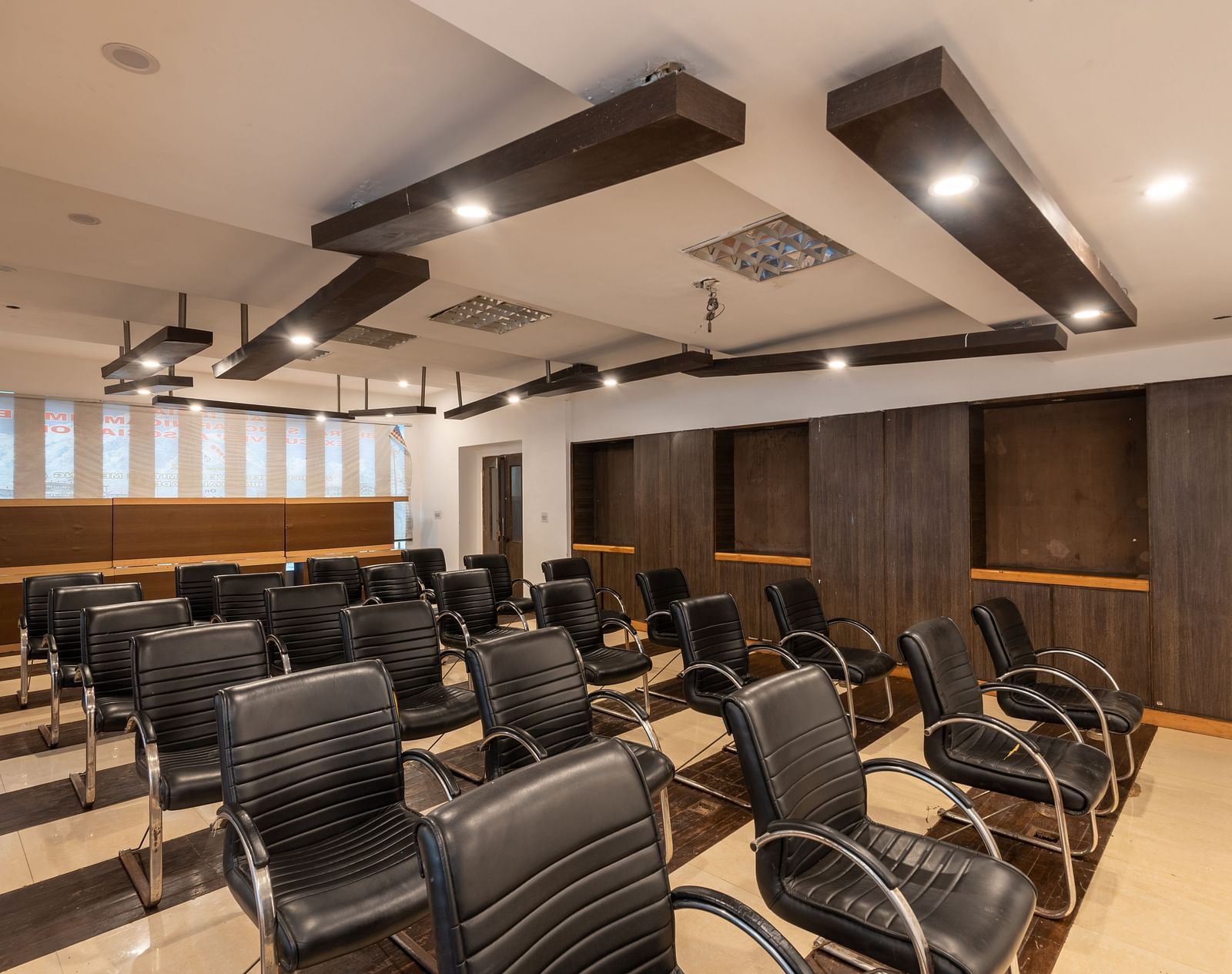Conference Hall  at DLS Spring Valley Resort Dharamshala  with chairs and tables arranged in theater setting 