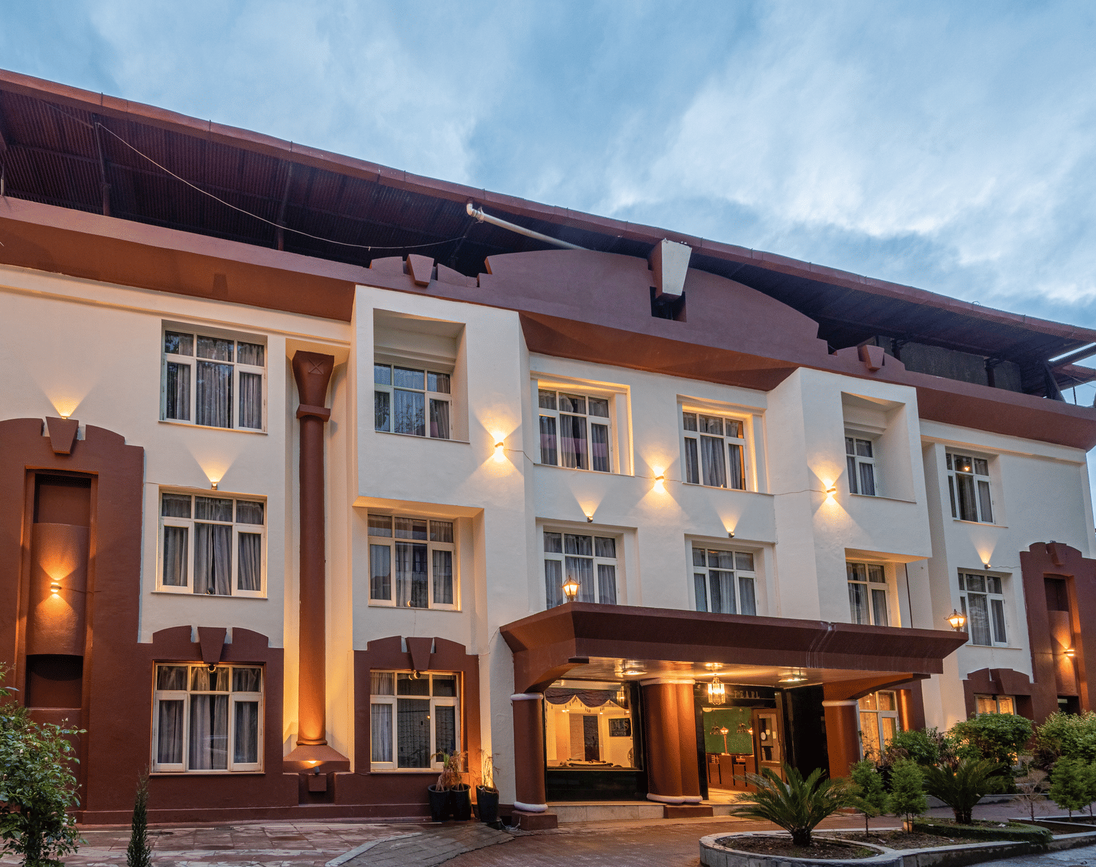 Shot of the facade of the hotel with sky in the background | DLS The Pearl