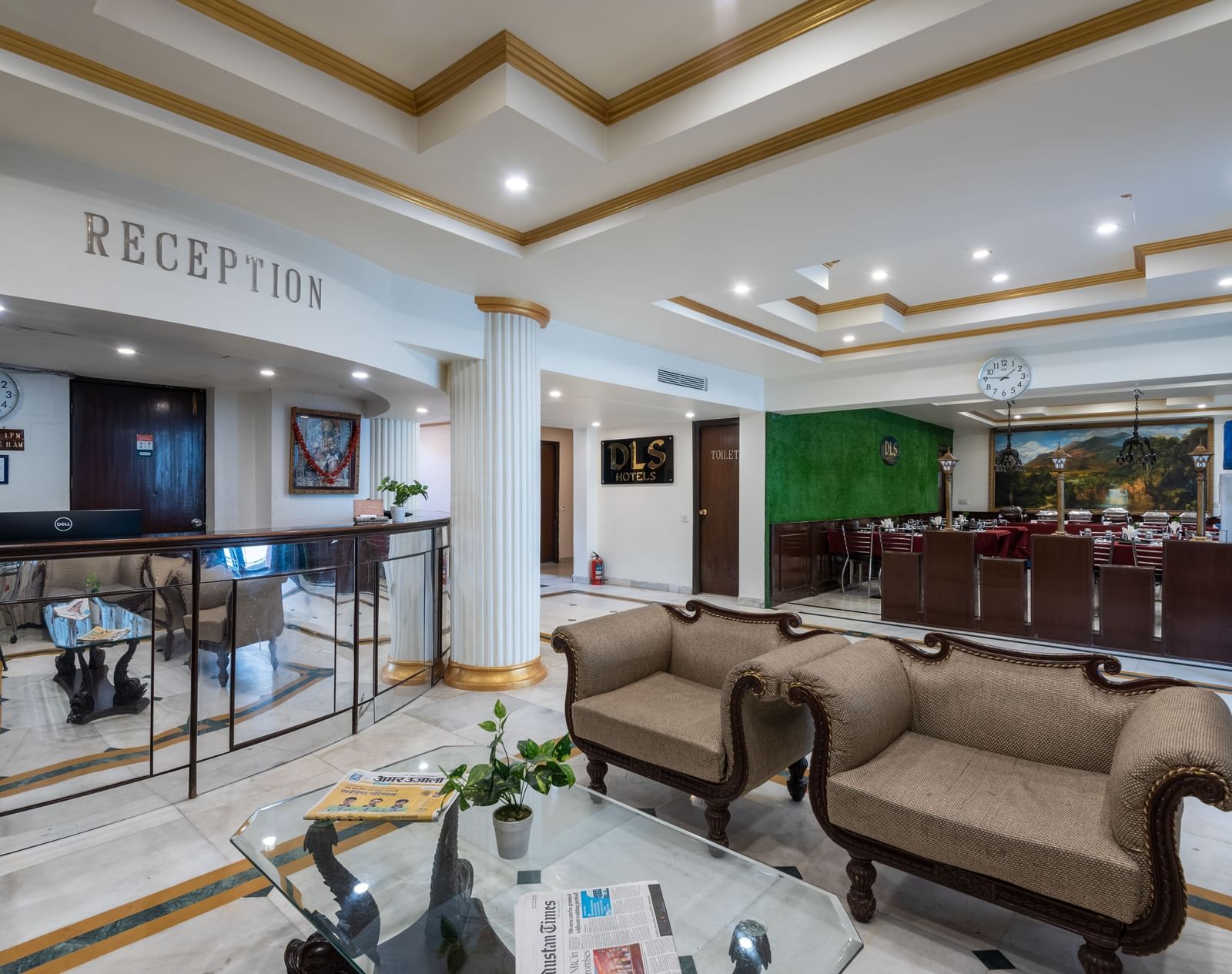 Image of the reception area at the hotel featuring some couches and a front desk  | DLS The Pearl