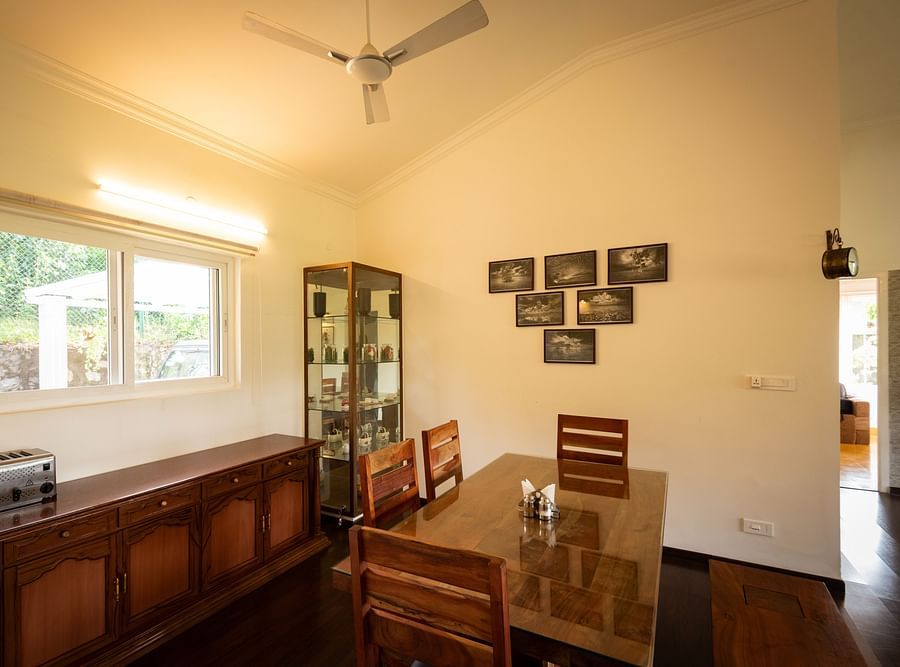Main House Dining Area with a dining table - Ibex Stays & Trails, Kotagiri