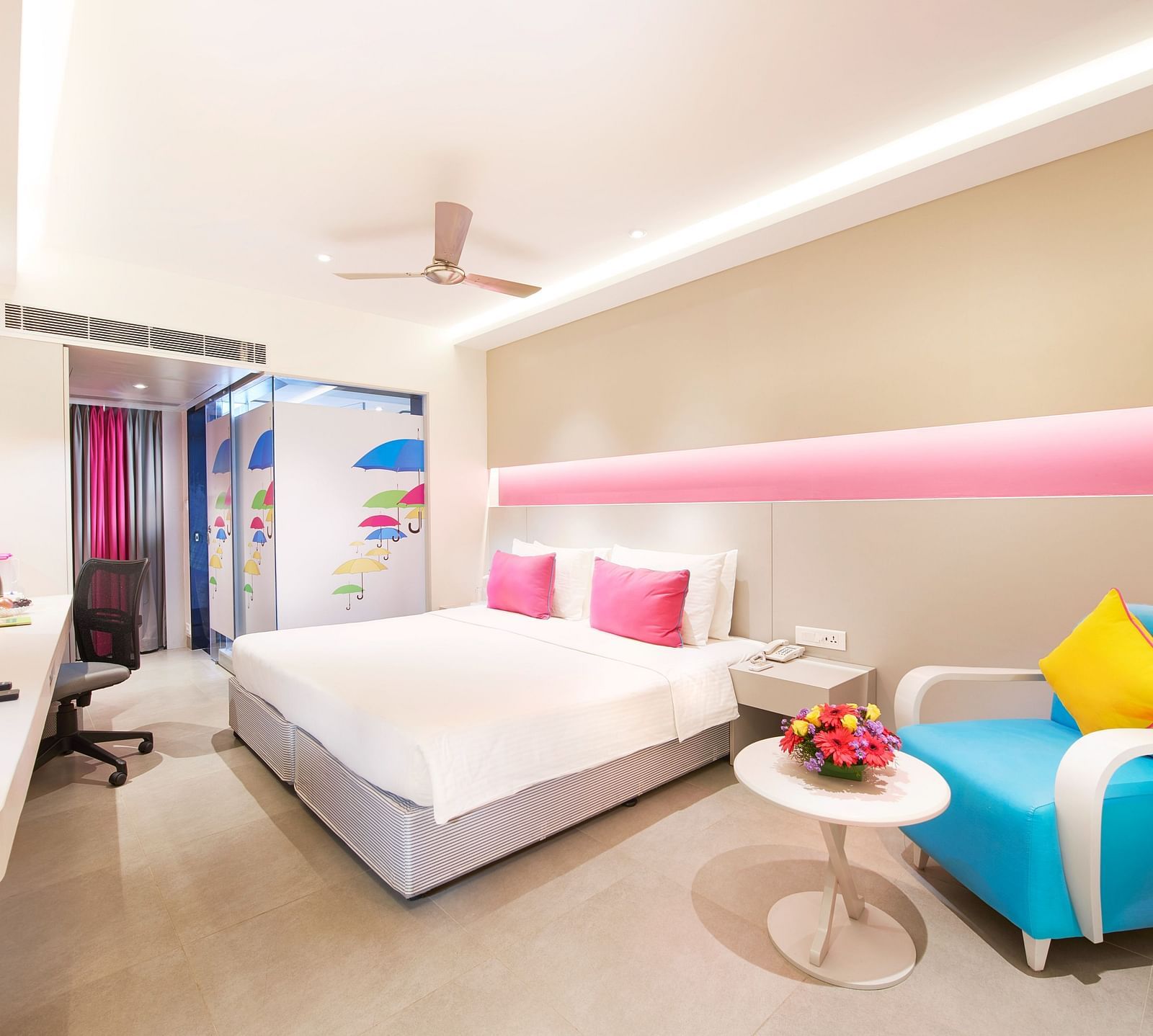 side view of a bedroom with a sofa at  Zibe Salem by GRT Hotels