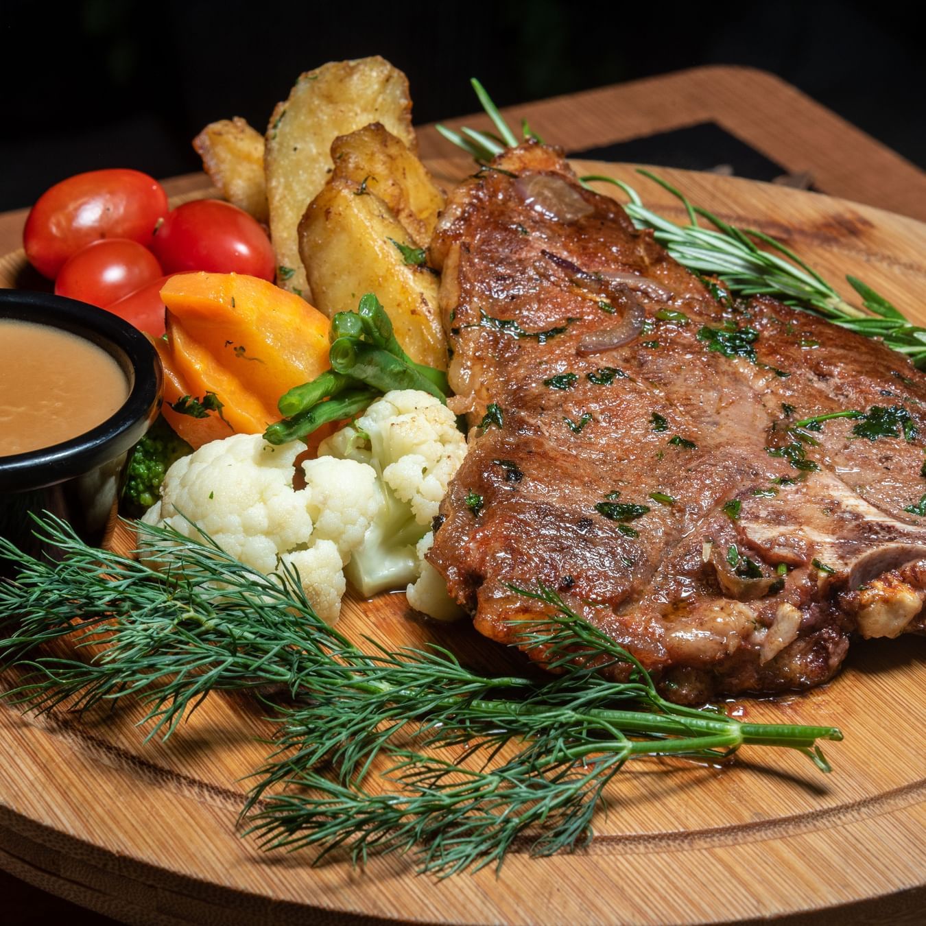 Juicy grilled steak served with vegetables, fries, and sauce at Best Western Premier Westlands hotel steakhouse restaurant.