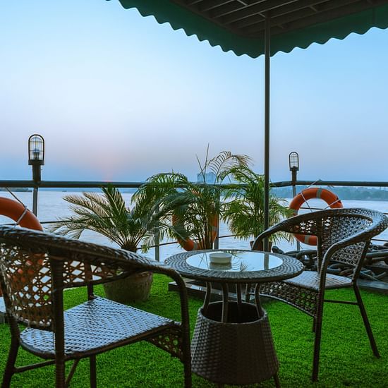 a seat for 2 at the outside deck overlooking the river hooghly - polo floatel kolkata