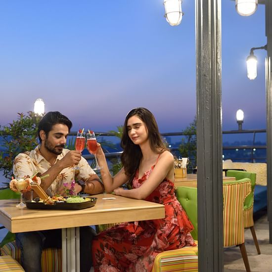 AVI 4627a couple having a dinner date at the outdoor seating area of the restaurant 5 - polo floatel kolkata