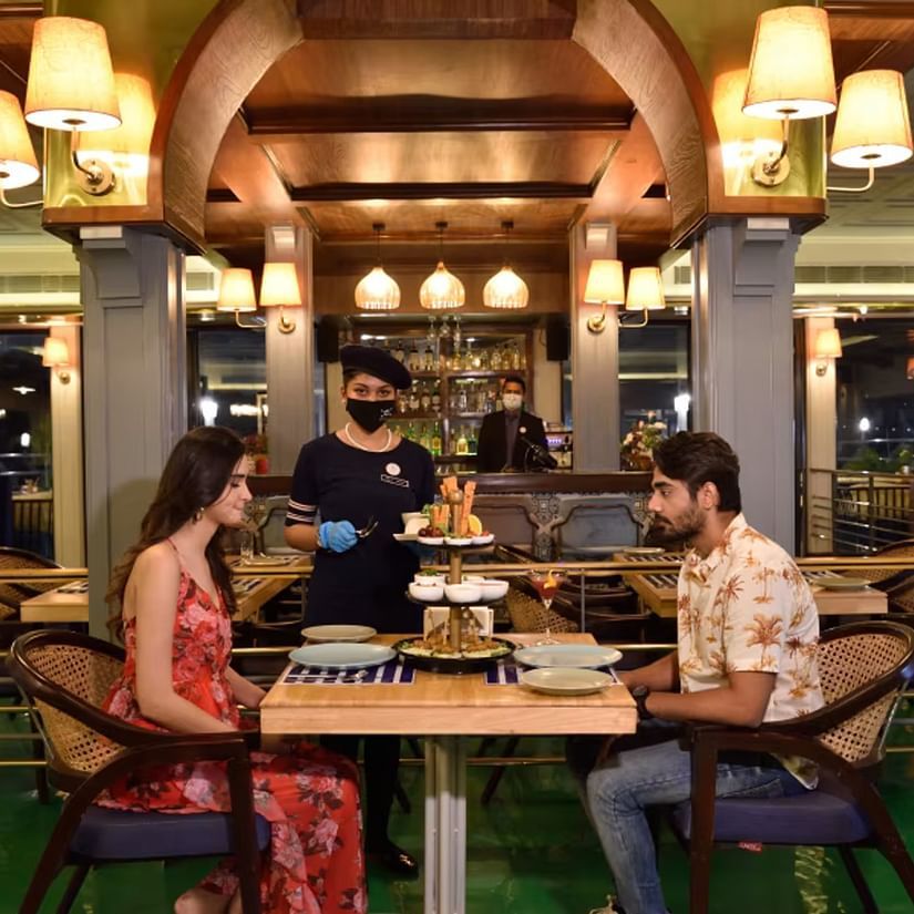 a couple ordering food at the dining space 6 - polo floatel kolkata