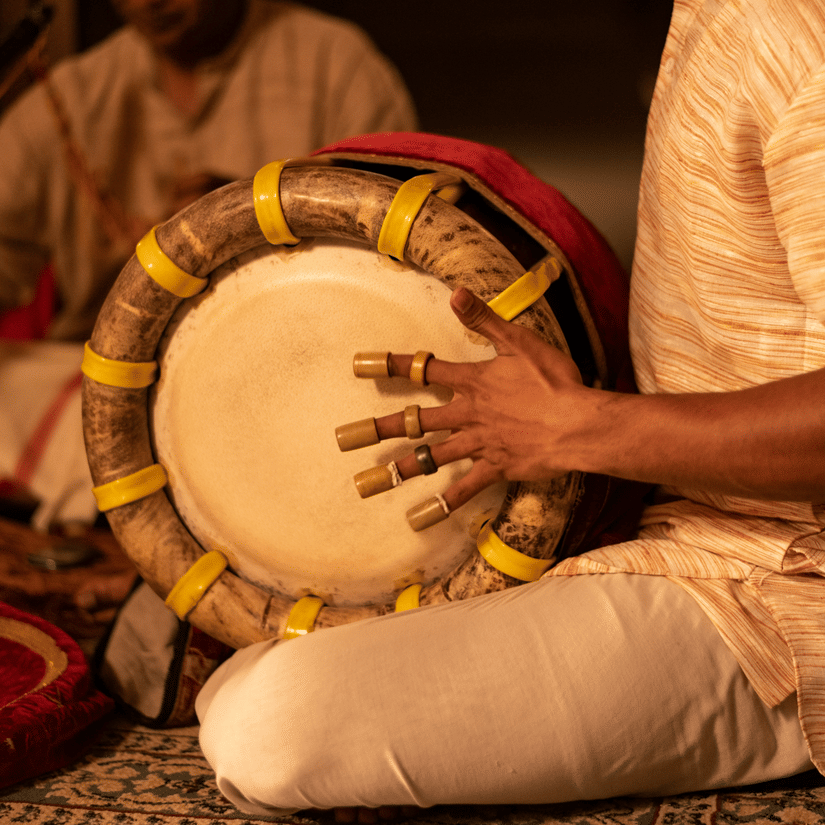 A traditional South Indian percussion instrument being played.