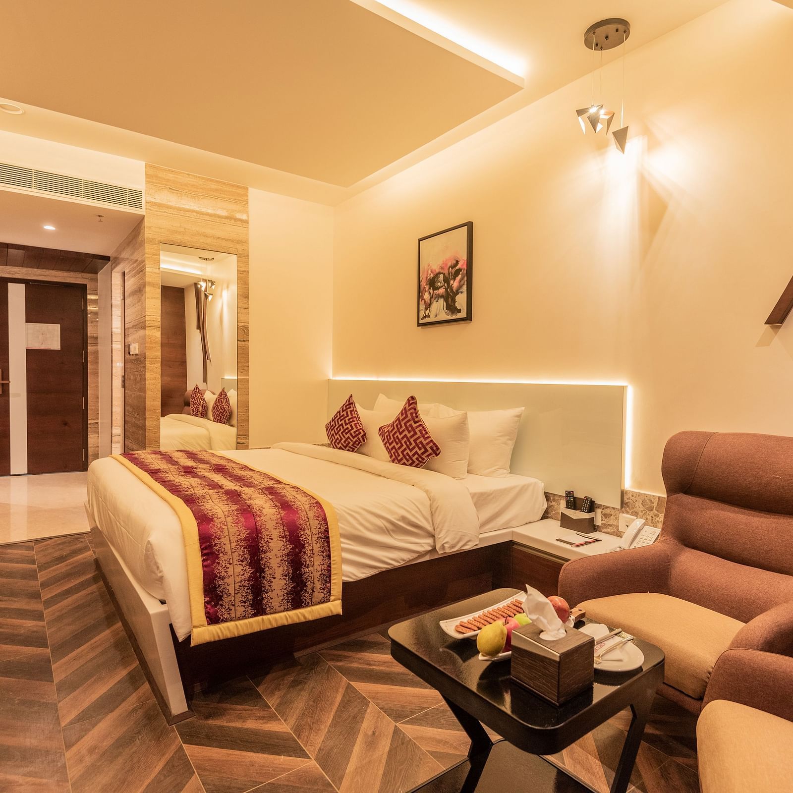 Club Room featuring a bed, sofa and a table at Hotel Park Elanza, Coimbatore