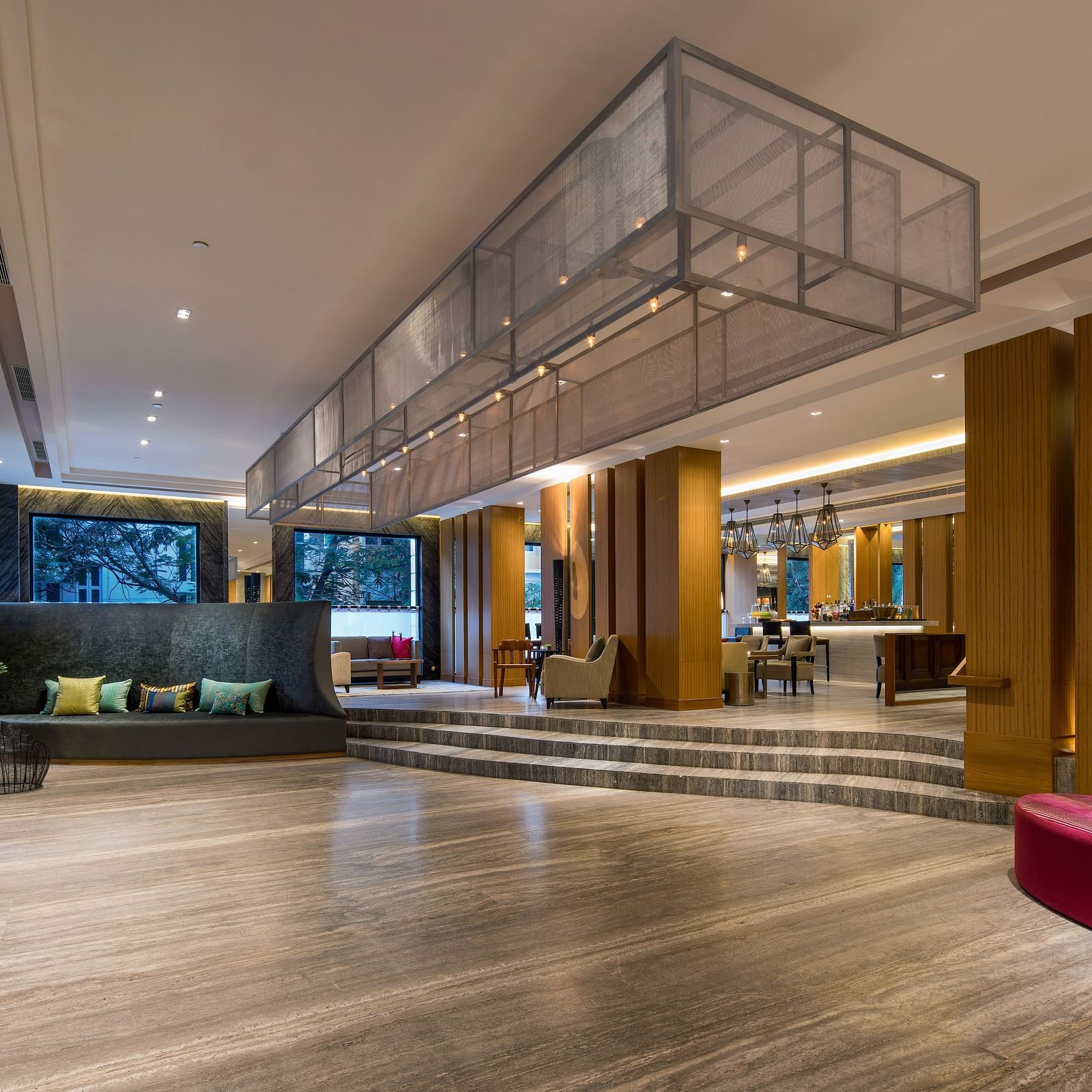 An overview of the Lobby at The Raintree St. Mary s Road with high ceiling and chic decor.