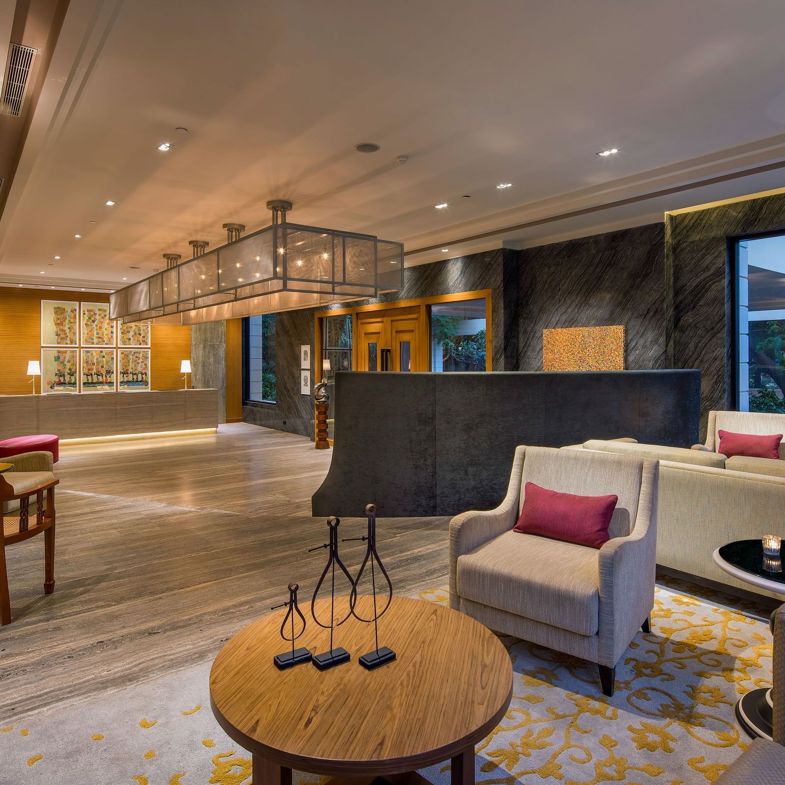 Image of a Lobby sitting area at The Raintree St. Mary s Road with high ceiling and chic decor.