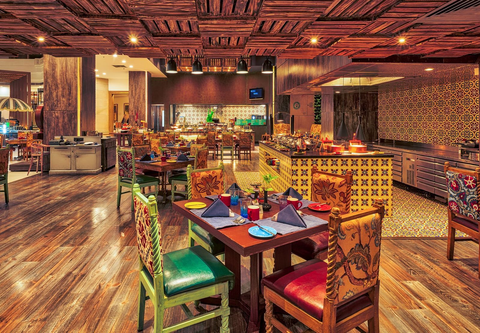 Seating arrangement of the restaurant at Grand Chennai By GRT Hotels.