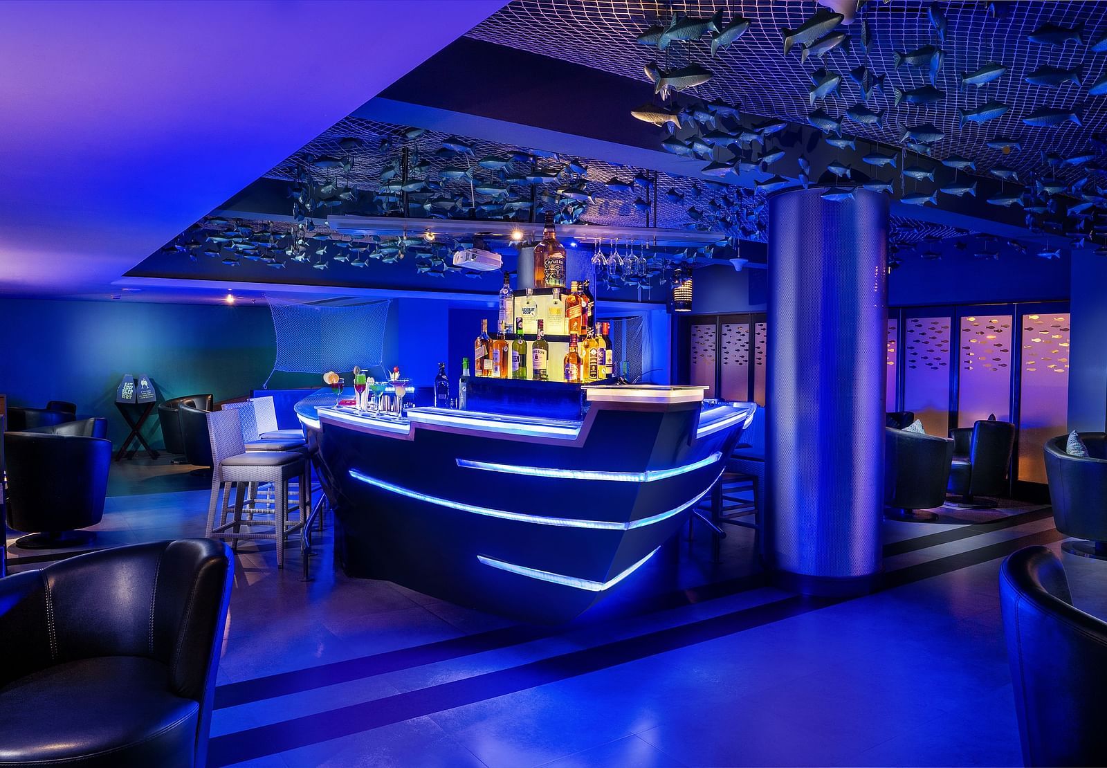 Image of a bar with seating arrangement at Grand Kakinada by GRT Hotels