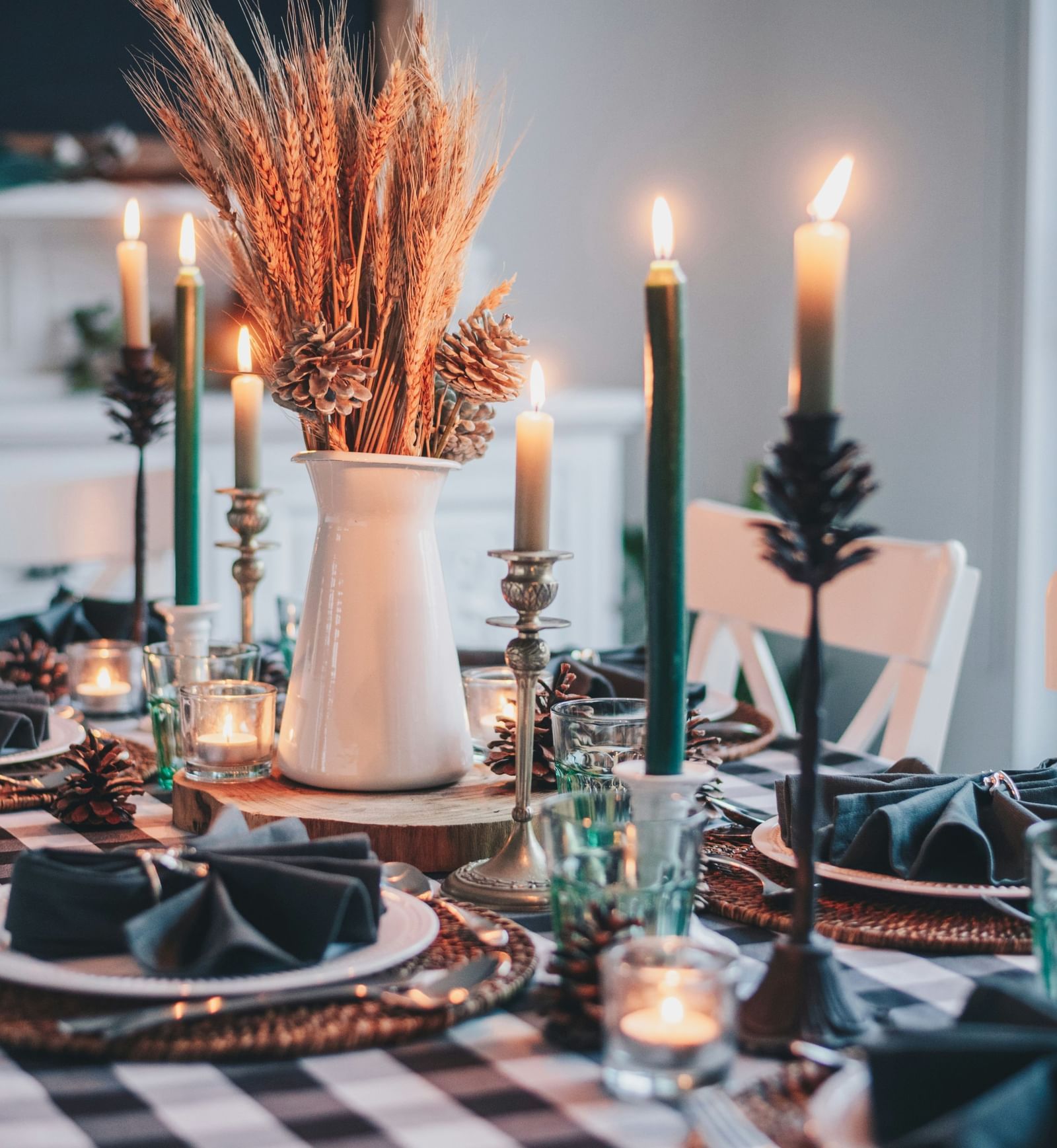 a close up shot of a table with cutlery, vase, and candlelights | Mango Hill, Pondicherry